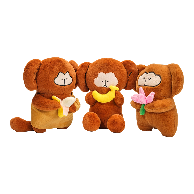 Boneka monyet yang menggemaskan dengan pisang dan bunga